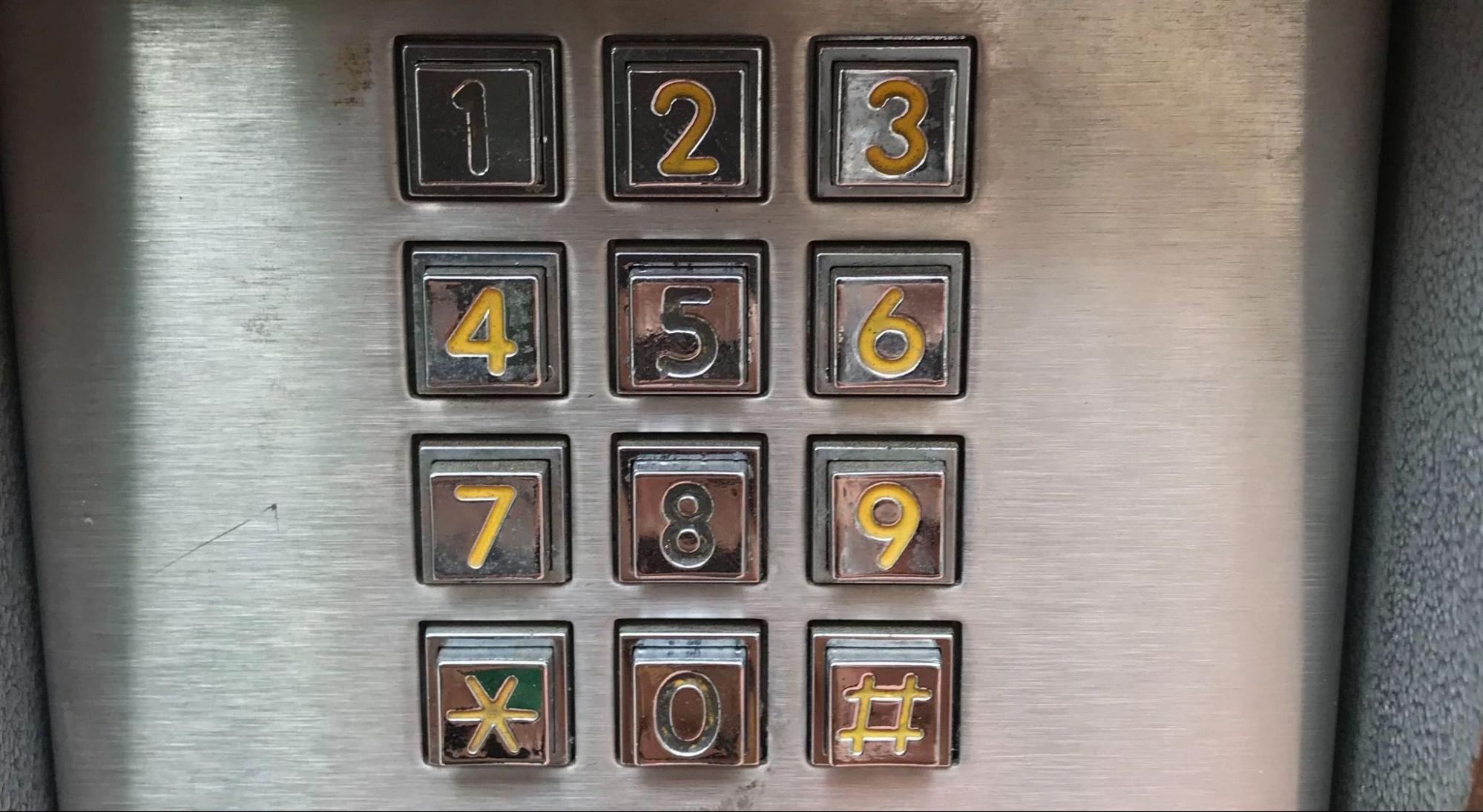 a numeric access keypad of which the paint on the numbers 1, 5, 8 and 0 are worn off. Source.