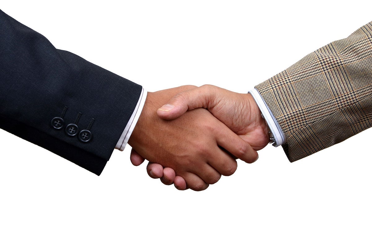 Cheesy handshake stock photo